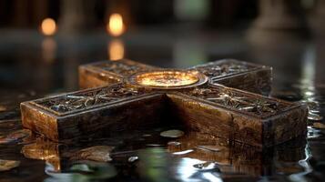 Intricate stone cross resting on still water surface in a dimly lit setting during evening hours photo