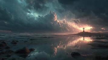 Dramatic sunset illuminates cross at shoreline with turbulent clouds reflecting on the water photo
