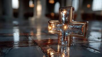 Shiny cross on the floor of a historic building reflecting light during the day photo