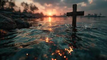 Cross standing in water during sunset with vibrant reflections and serene atmosphere photo