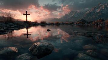 Serene sunset at a mountain lake with a cross reflecting in the water photo