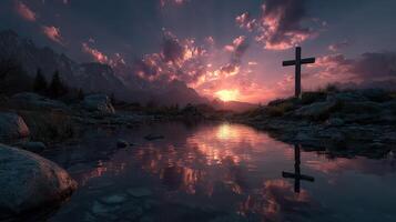 Sunset reflection over still water with cross silhouette in mountain landscape photo