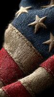Close-up view of a vintage flag showcasing its texture and colors with stars and stripes in rich detail photo