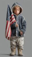 Young child holding American flag in warm jacket and boots during chilly outdoor scene in urban environment photo