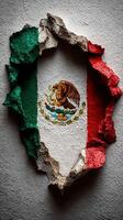 Cracked wall revealing the vibrant colors of the Mexican flag with an eagle emblem photo