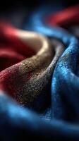 Beautiful textile with blue, red, gold, and black color blends creating a rich and dynamic pattern photo