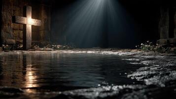 Moody atmosphere in an ancient stone setting with a cross and water reflecting light photo