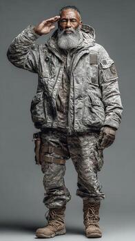 Saluting soldier in tactical gear stands proudly with a determined expression in a neutral background photo