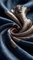 Intricate swirl of textile fabric showcasing deep blue and metallic gold colors photo