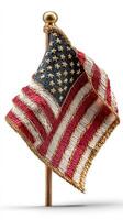 Handcrafted miniature American flag displayed on a golden pole in a symbolic representation of patriotism and national pride photo