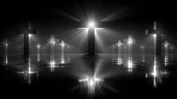 Religious symbolism with glowing crosses reflected in water at night creating a serene atmosphere photo