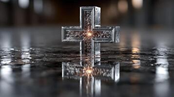 Reflective metal cross on wet surface in artistic composition with background lighting photo