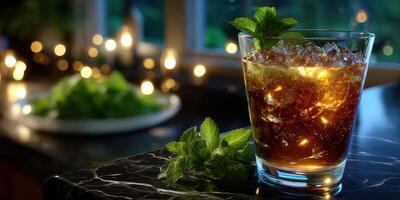 Refreshing drink with mint served on a marble countertop during evening gathering photo