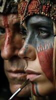 Traditional face painting in an Indigenous ceremony showcasing cultural significance around artistic expression and community bonding photo