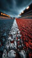 Vibrant racing track with contrasting colors under a dramatic sky at twilight photo