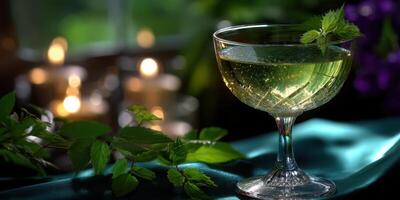 Refreshing green cocktail served in elegant crystal glass against soft candlelight background photo