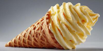 Delicious vanilla ice cream cone with smooth texture and crisp waffle cone enjoyed as a summer treat photo