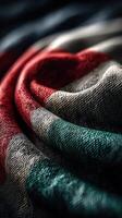 Close-up of colorful fabric showcasing intricate textures in soft lighting photo