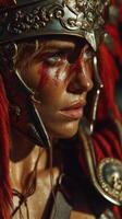 Fierce warrior adorned with ornate helmet and battle armor displaying vivid war paint in dramatic light photo