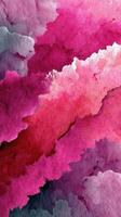Colorful abstract watercolor artwork featuring vibrant shades of pink and gray in a fluid pattern with soft edges photo