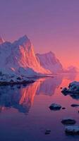 Breathtaking winter landscape at dusk with snow-capped mountains reflecting in serene water photo