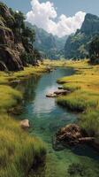 Serene river flowing through a lush valley surrounded by mountains on a sunny day photo