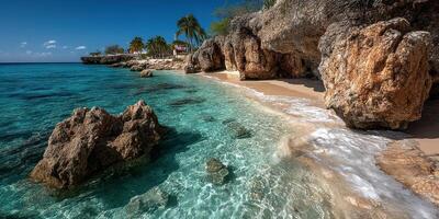 Breathtaking shoreline with clear turquoise water and rocky formations under a bright blue sky photo