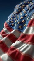 Waving American flag close-up showcasing meticulous stitching and vibrant colors in natural light photo