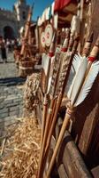 Bows, arrows, and festival atmosphere in a bustling medieval marketplace during a sunny day photo