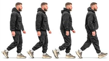 Man walking in casual black athletic wear in a neutral background showcasing different postures during movement photo