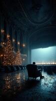Empty theater with Christmas trees and a solitary figure reflecting on the stage during a quiet winter evening photo