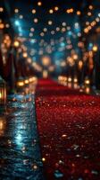Elegant red carpet leading to a glamorous event with soft lighting and sparkling decorations at night photo
