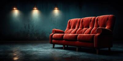 Vintage red sofa in a dimly lit room with industrial style lighting creating a moody atmosphere photo