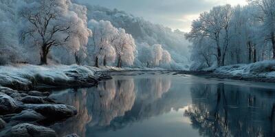 Winter landscape with frost-covered trees and calm river reflecting the serene atmosphere during early morning light photo
