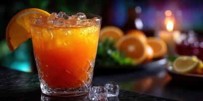Refreshing citrus cocktail served in a crystal glass with ice in a cozy bar setting at night photo
