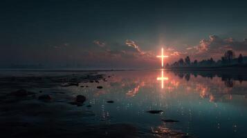 Beautiful reflection of a glowing cross over calm water during sunset at a serene lakeside location photo