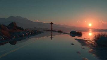 Sunrise over a tranquil lake with a cross silhouette in the foreground and distant mountains photo
