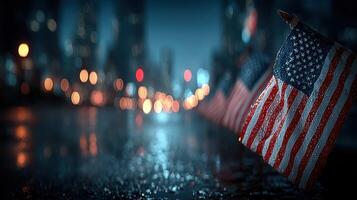 American flags lined along a wet street at night in a city, illuminated by soft city lights photo