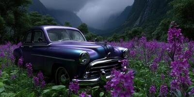 Classic car resting in a field of vibrant purple flowers amidst a mystical mountainous backdrop photo