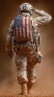 Soldier in military gear saluting with American flag patch against dusty backdrop during training exercise photo