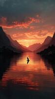 Serene sunset over the mountain lake with a bird soaring above the water's surface photo
