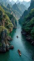 Boats navigate through a tranquil river surrounded by lush mountains in a serene landscape during the early morning light photo