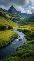 Majestic mountain valley with a winding river and lush green landscape during daylight photo