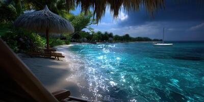 Relaxing beach with clear turquoise water and a sailboat at dusk photo