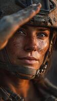 Female soldier in combat gear saluting at sunset in a military environment displaying resilience and determination photo