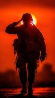 Soldier saluting at sunset with vibrant colors in the background photo