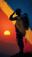 Soldier saluting at sunset with vibrant sky and silhouette against mountains photo