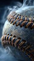 Close-up view of a worn baseball highlighting its stitching and texture in a dramatic setting photo