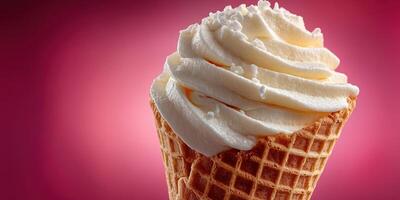 Delicious whipped cream topping on an ice cream cone against a vibrant pink background photo