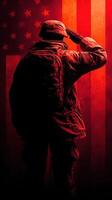 Soldier saluting against a backdrop of an American flag illuminated in red tones during twilight photo